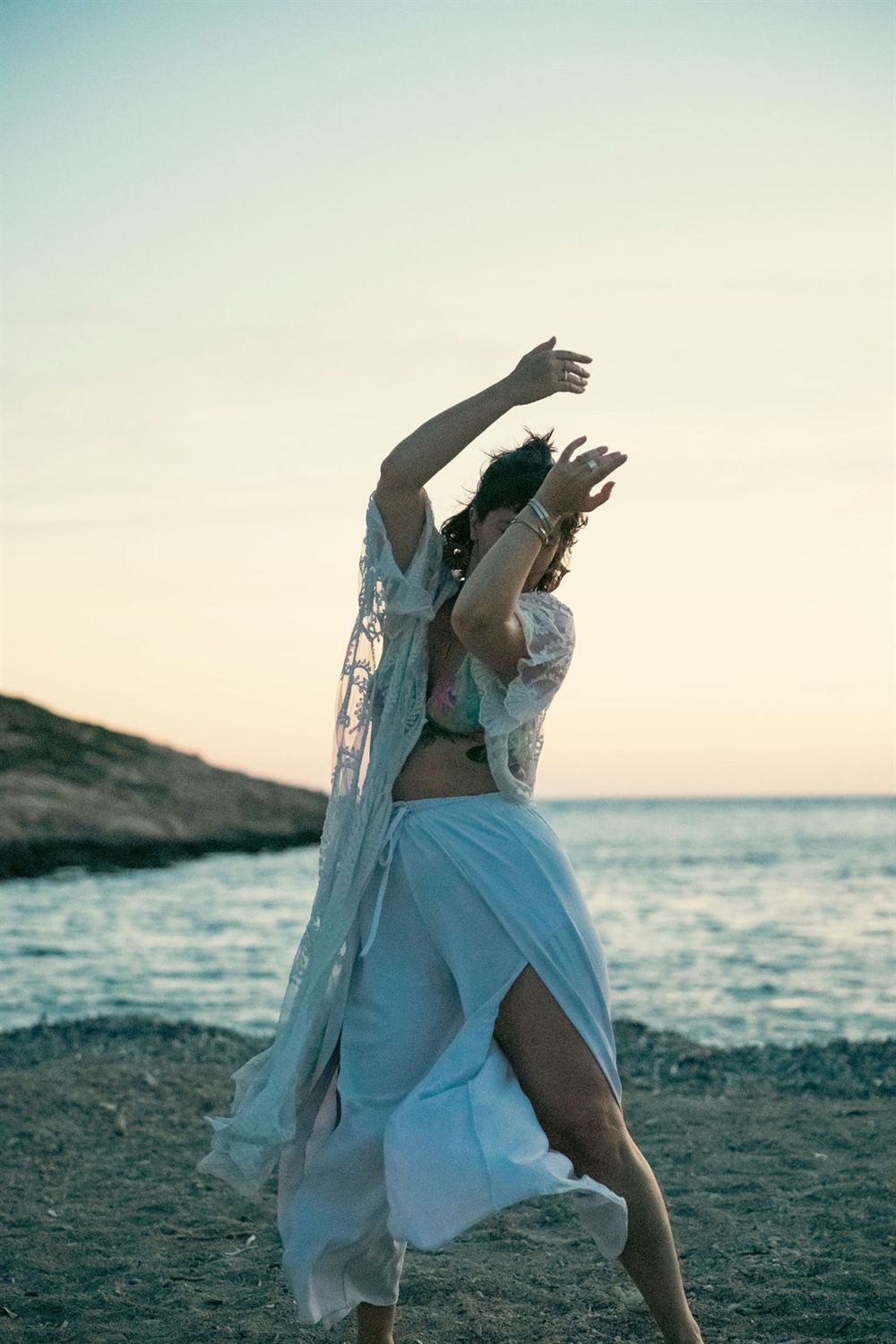 Dancing on the beach at sunset