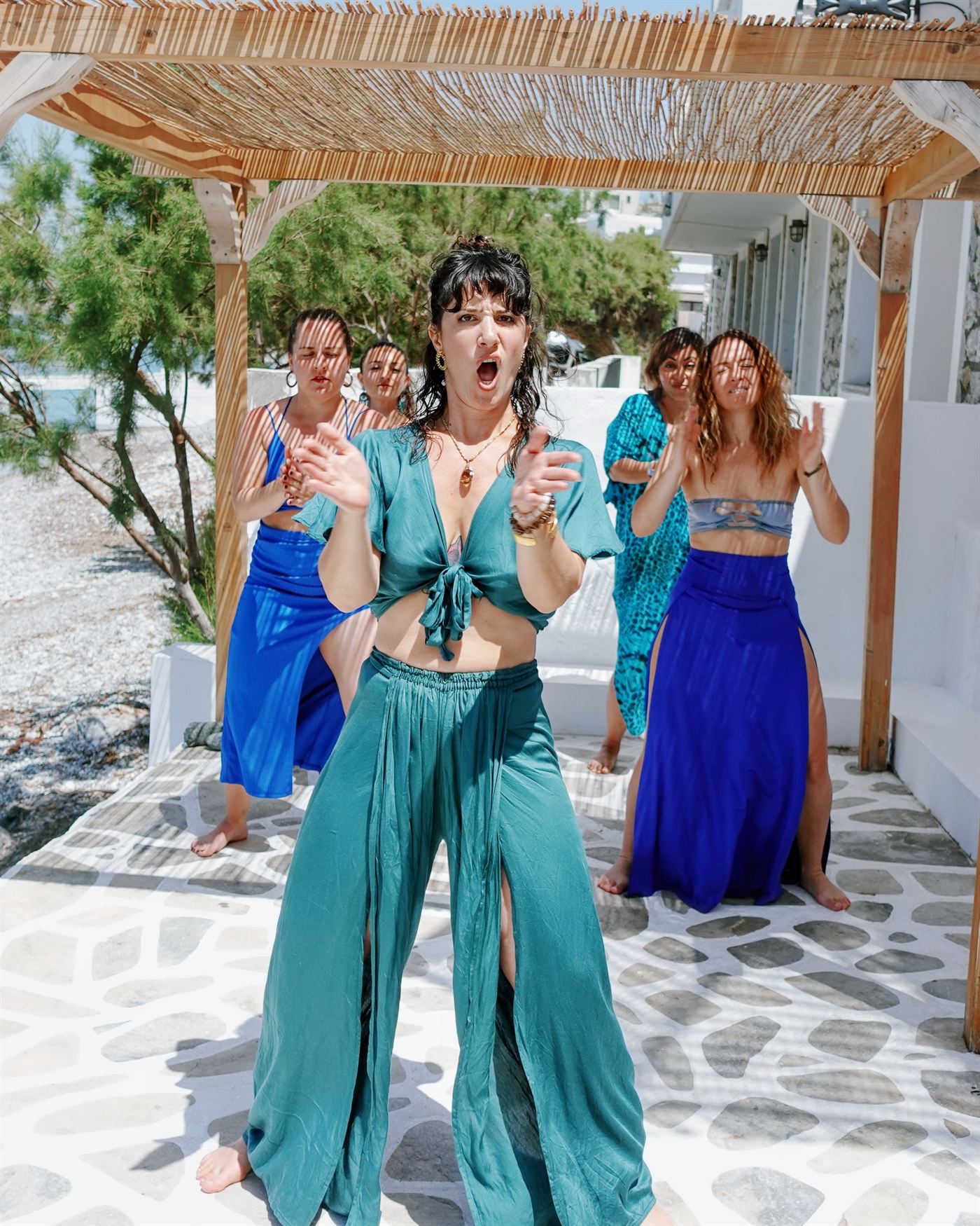 Gal leading a group, dancing together